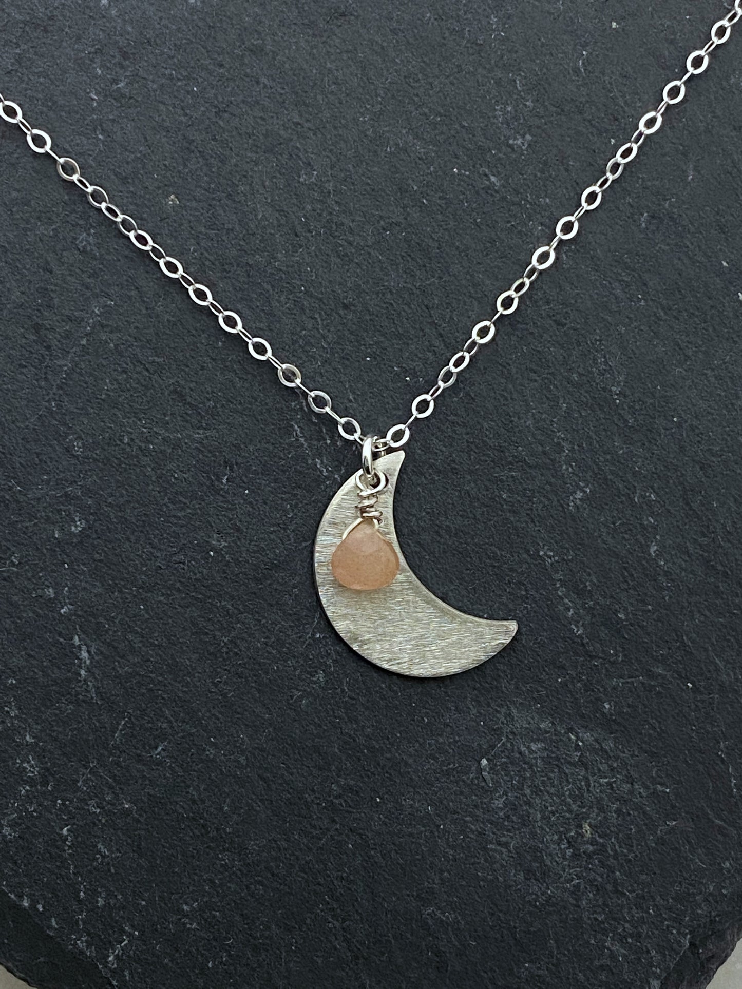 Forged sterling silver moon necklace with peach moonstone