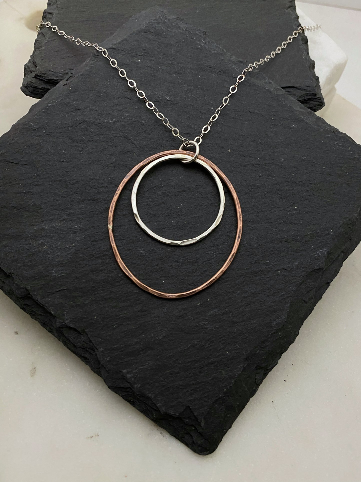 Sterling silver and copper forged hoop necklace