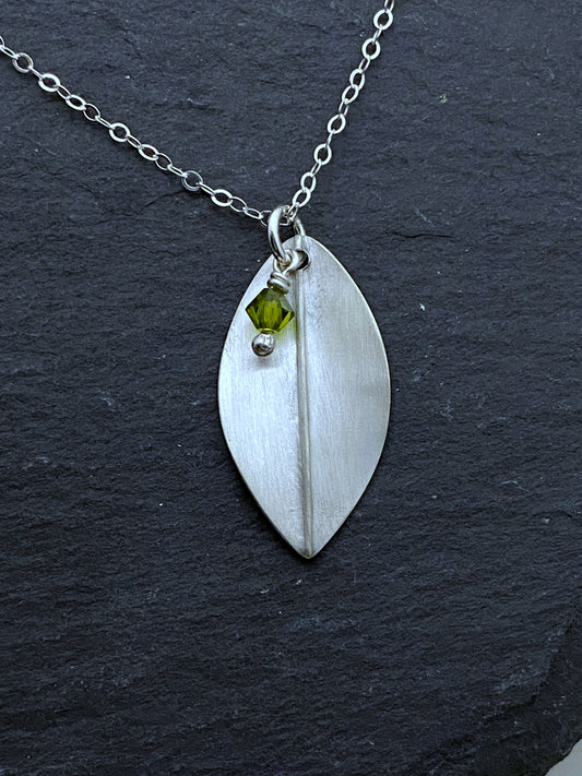 Forged sterling silver leaf necklace with olivine gemstone