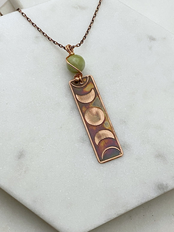 Moon phase acid etched copper necklace with green garnet gemstone