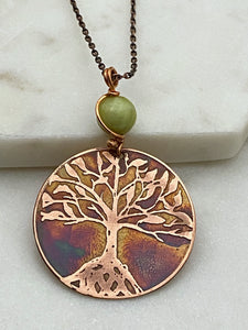 Acid etched copper tree necklace with green garnet gemstone