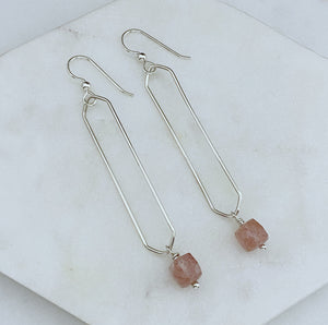 Sterling silver hammer textured oval hoops with strawberry quartz