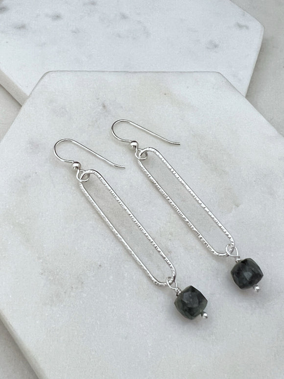 Sterling silver oval hoops with emerald