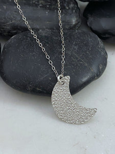 Sterling silver hammer textured moon necklace