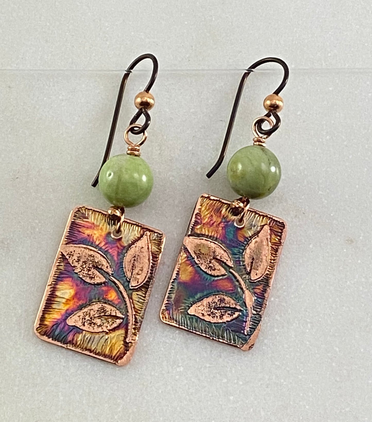 Acid etched copper earrings with green garnet gemstones