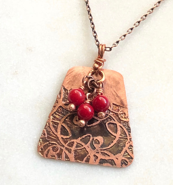Acid etched copper swirl necklace with coral