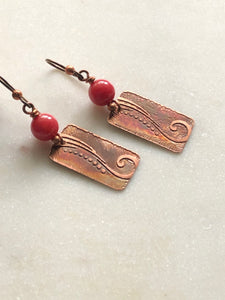 Acid etched copper swirl earrings with coral gemstones