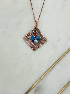 Acid etched copper wood grain necklace with apatite