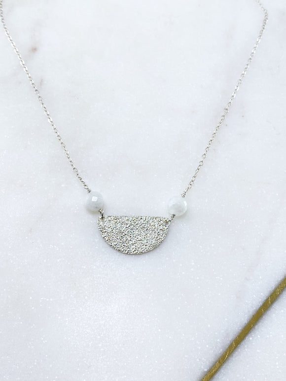 Sterling silver hammer textured half circle necklace with moonstone.