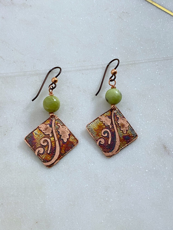 Acid etched copper swirl earrings with green garnet